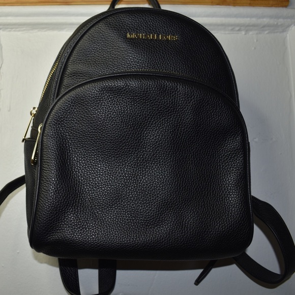 Michael Kors Handbags - Michael Kors backpack on black pebbled leather